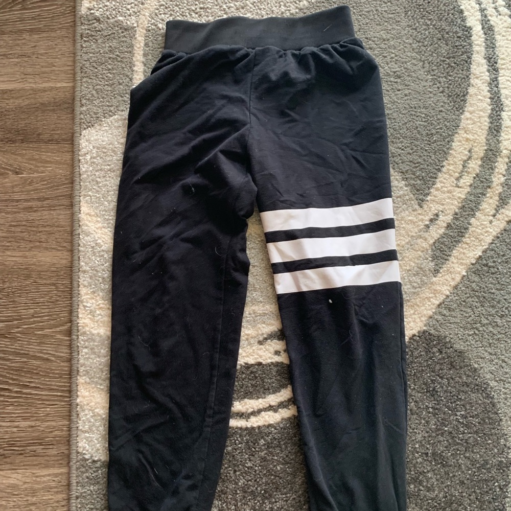 black joggers with white stripes
